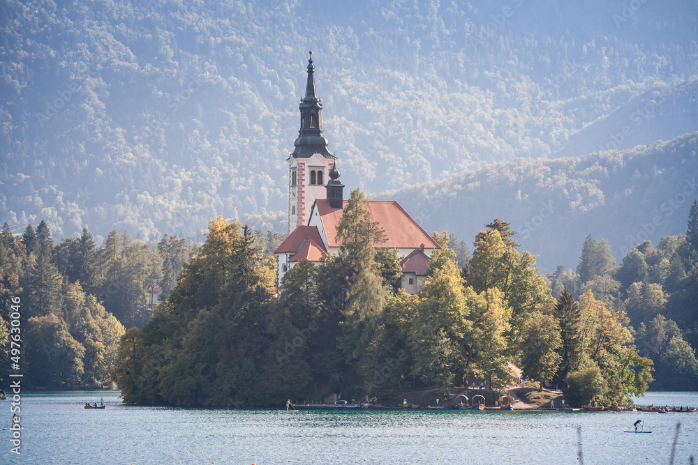 Selective blur on the Blejsko ostrvo, or bled island, on Bled lake or Blejsko Jezero, with assumption of Maria church, or cerkev marijinega vnebovzetja. it's catholic church and monument of Slovenia