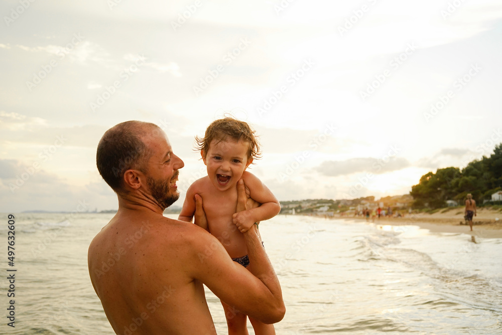 Father and happy daughter on the beach Father and happy daughter on the beach