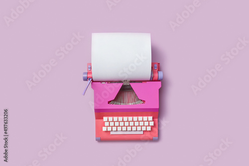 Retro typewriter with blank sheet of paper photo