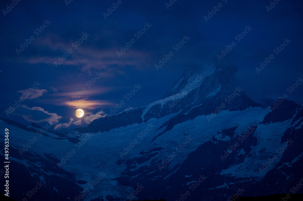 rising full moon over Schreckhorn near Grindelwald