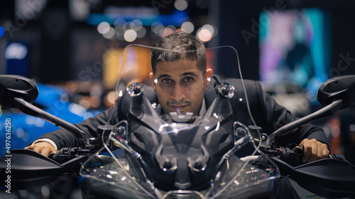 caucasian man riding on motorcycle in motorshow