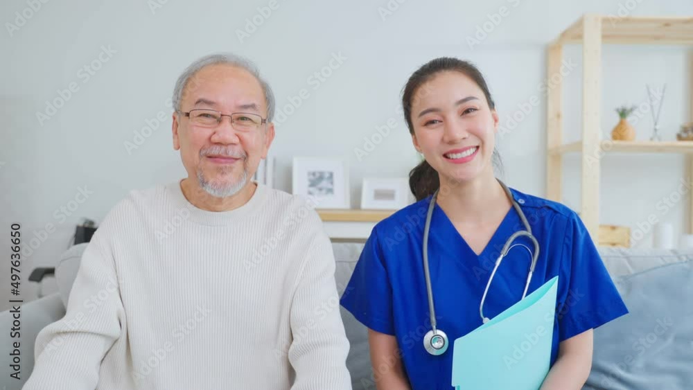 Portrait of Asian caregiver nurse sit on sofa and take care senior man Portrait of Asian caregiver nurse sit on sofa and take care senior man