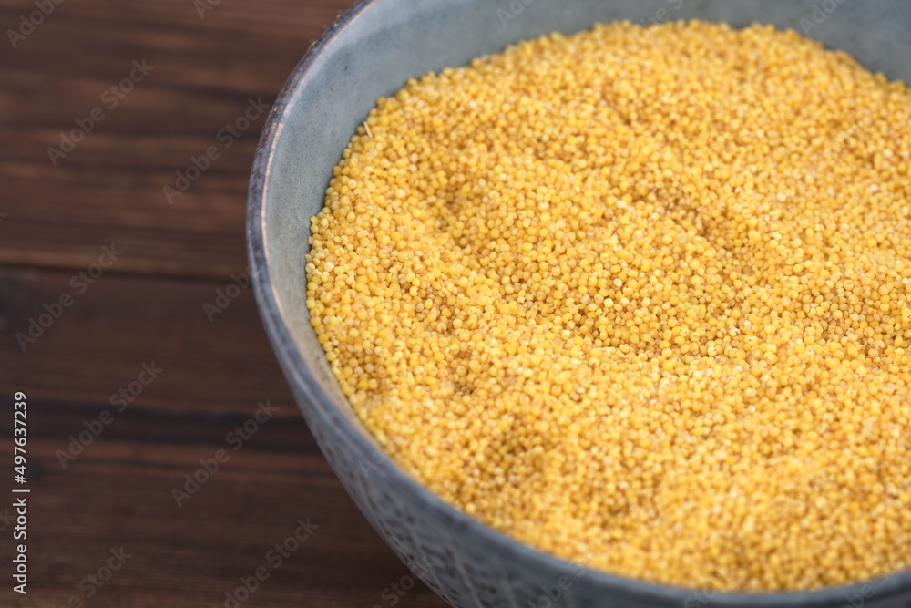 a bowl of millet on table a bowl of millet on table