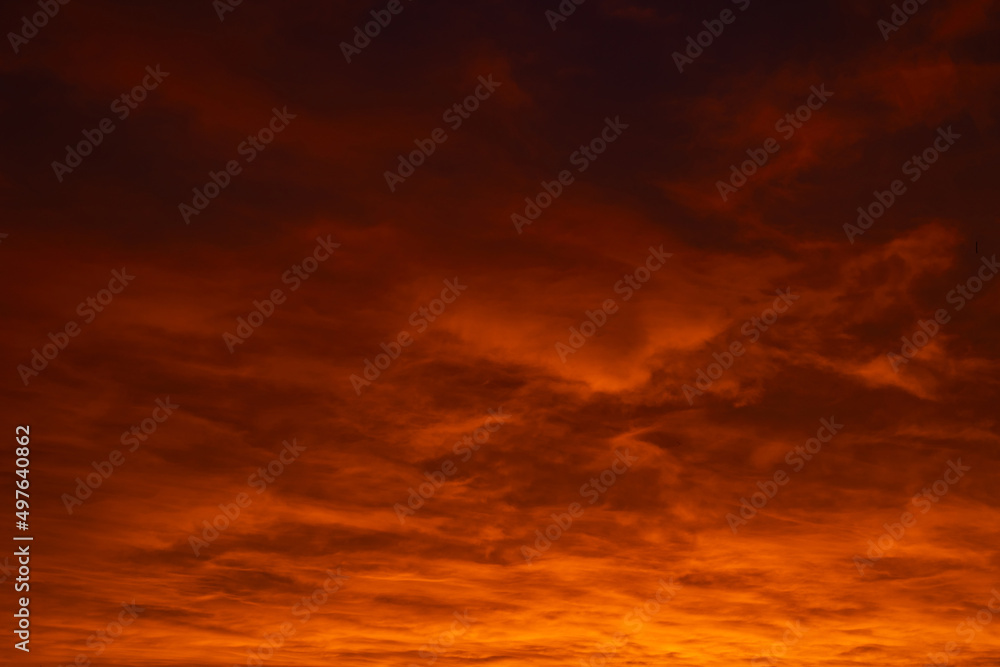 Cloudscape at sunrise or sunset. Orange clouds during sunset background photo