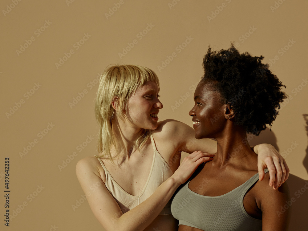 2 young woman showing love - natural skin and body 2 young woman showing love - natural skin and body