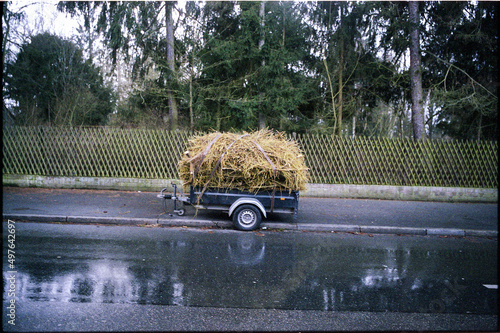 Car trailer with kindling parked on the street