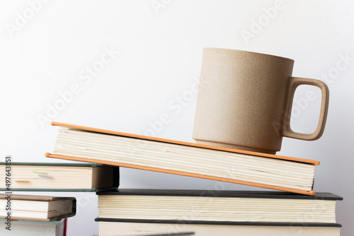 Coffee mug and books