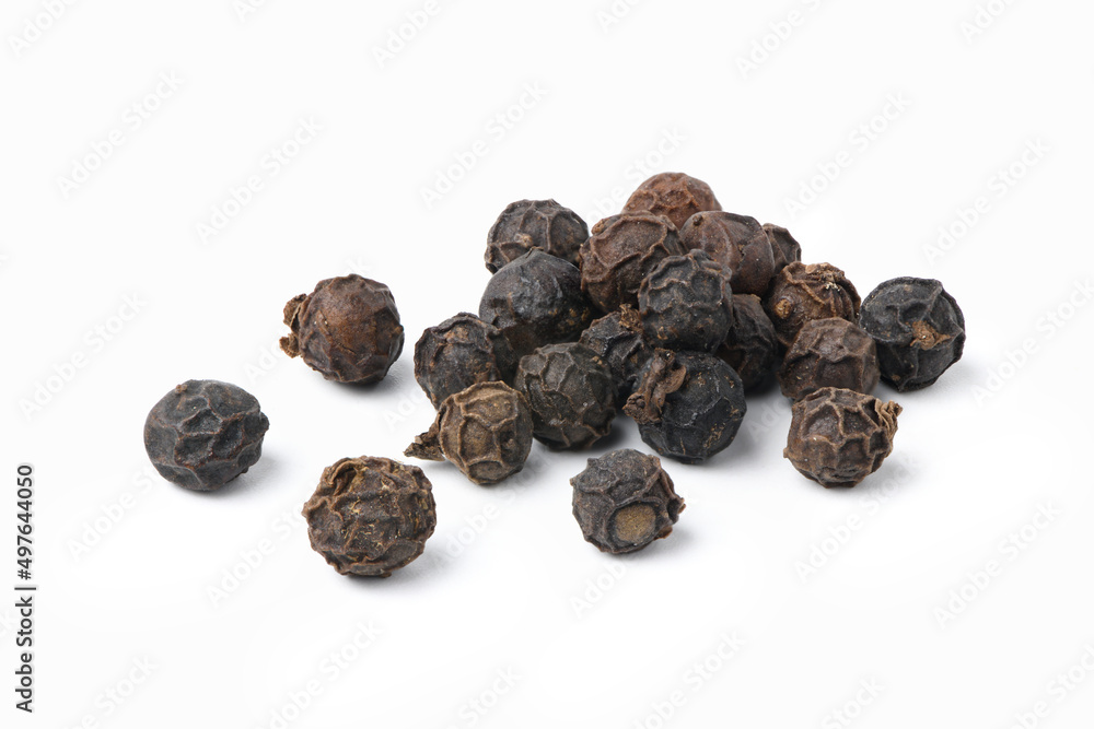 Close-up of black peppercorns (black pepper) isolated on white background. Close-up of black peppercorns (black pepper) isolated on white background.