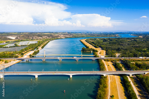 Picturesque aerial view of Rhone river with three bridges near small town Roquemaure in Gard department of southern France photo