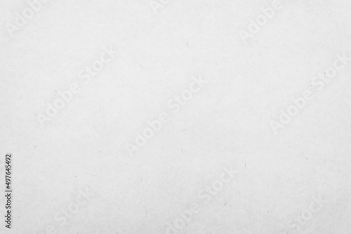 White recycled craft paper texture as background. Grey paper texture, Old vintage page or grunge vignette of old cardboard. 