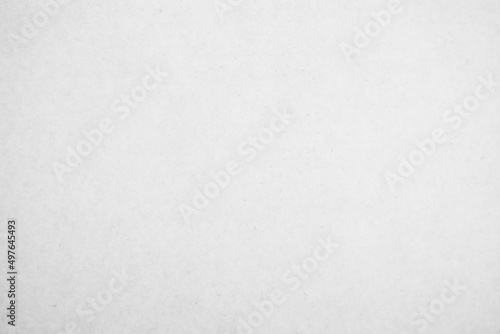 White recycled craft paper texture as background. Grey paper texture  Old vintage page or grunge vignette of old cardboard. 