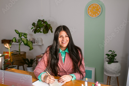 Happy bussineswoman working in modern office photo