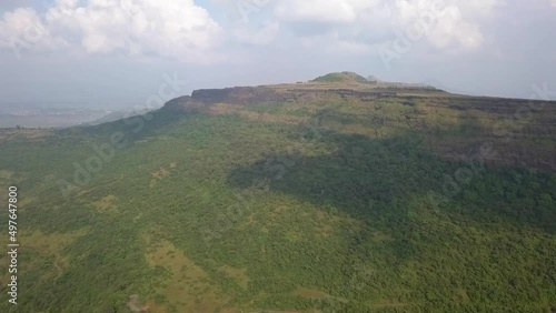 Aerial flies to fortified walls of medieval Visapur Fort in lush India photo