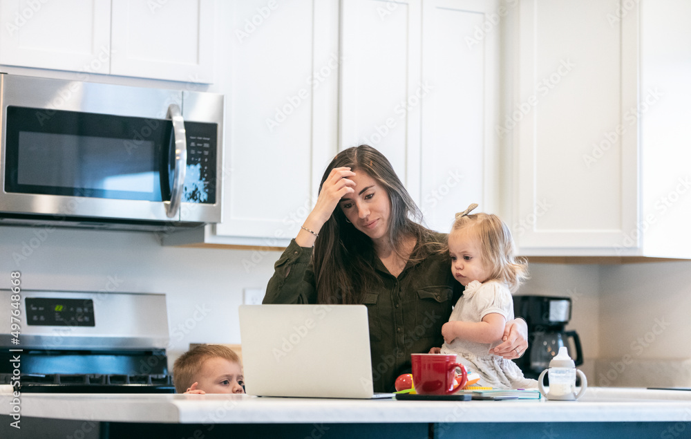 Tired Mother Trying To Work With Children Tired Mother Trying To Work With Children