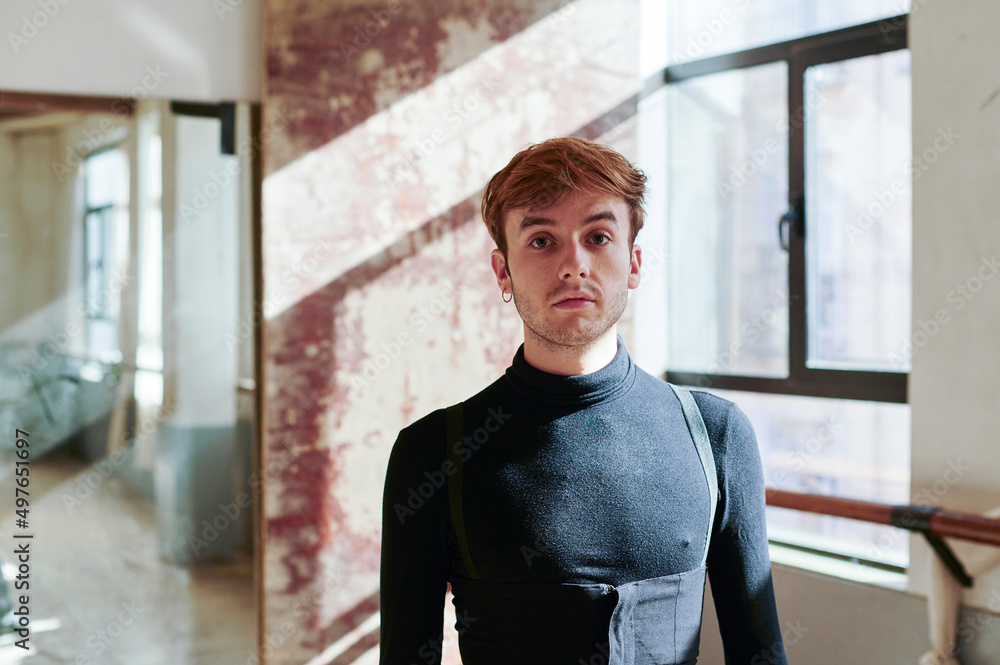 Young male flamenco dancer standing in a studio Young male flamenco dancer standing in a studio