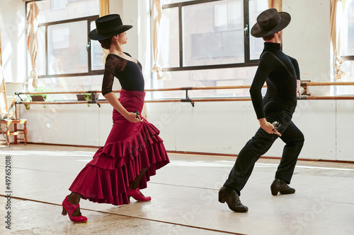 Flamenco performers dancing in traditional clothes photo