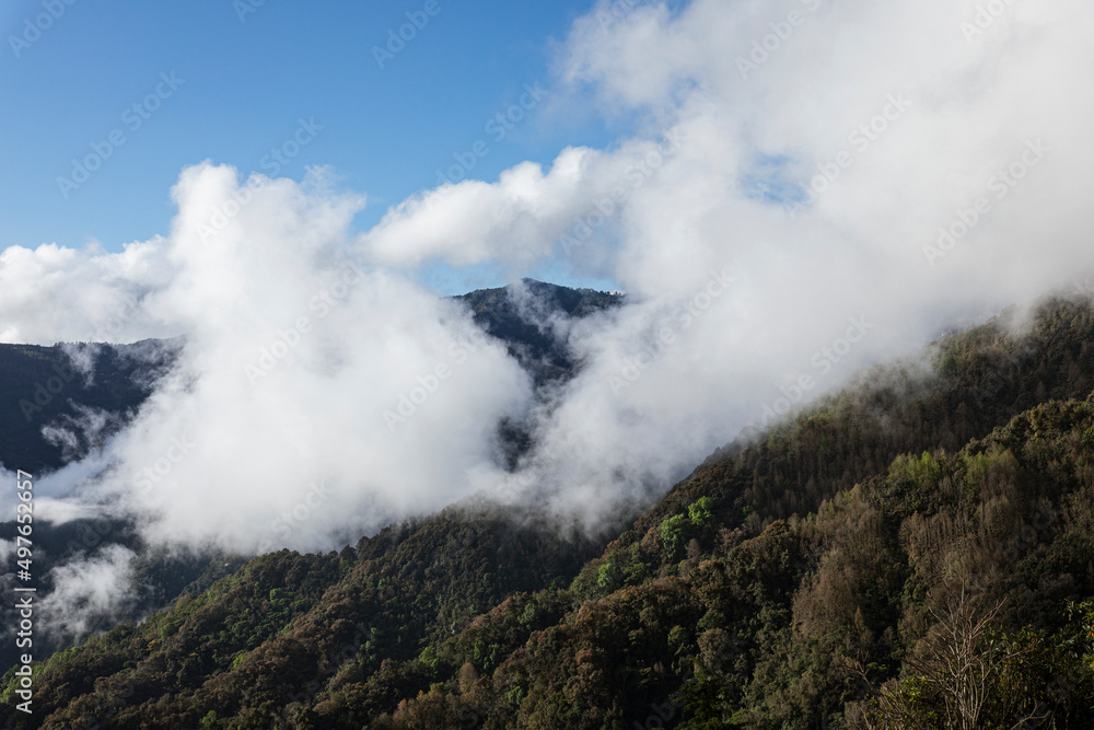 Mountain covered by clouds Mountain covered by clouds