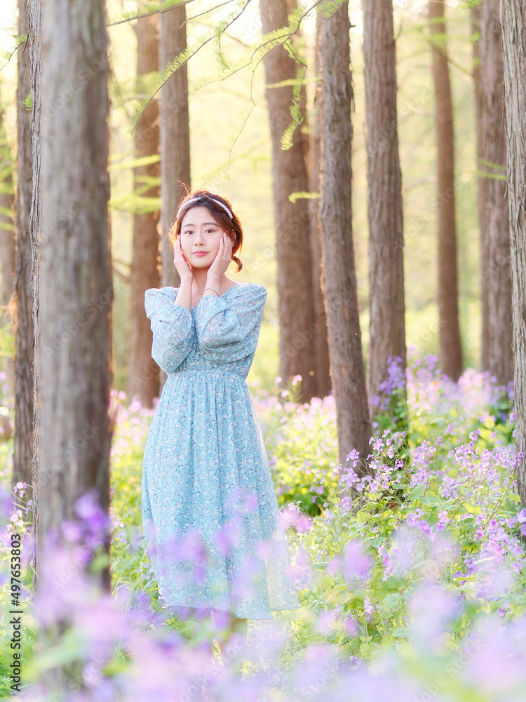 Portrait of elegant Chinese girl in dress enjoy carefree time in forest park in sunny day. Outdoor fashion portrait of glamour young Chinese cheerful stylish woman. Portrait of elegant Chinese girl in dress enjoy carefree time in forest park in sunny day. Outdoor fashion portrait of glamour young Chinese cheerful stylish woman.