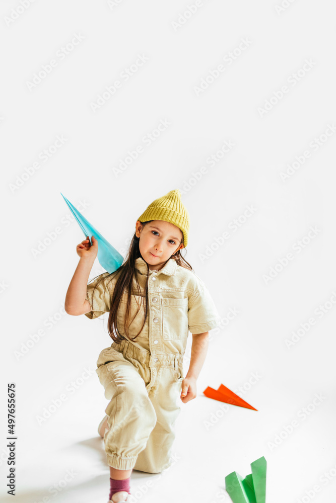 Little Girl Playing with Paper Airplanes Little Girl Playing with Paper Airplanes