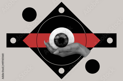 Collage in surrealism style with female hand hold eye