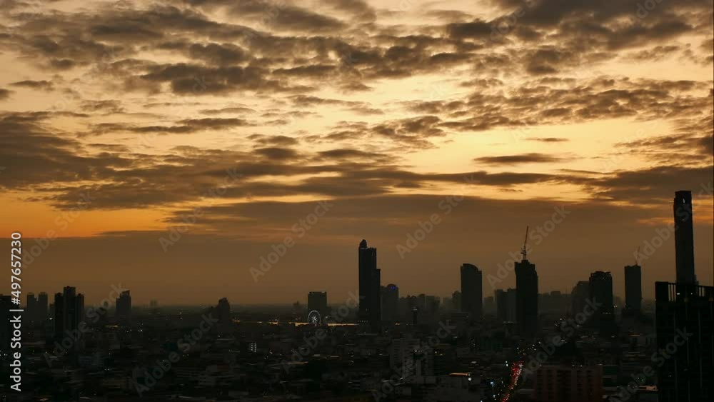 Time-lapse of the sunset scene of Bangkok skyline and skyscraper in Bangkok city downtown at the rooftop of Hotel, Chan Road Sathorn, Bangkok, Thailand. Time-lapse of the sunset scene of Bangkok skyline and skyscraper in Bangkok city downtown at the rooftop of Hotel, Chan Road Sathorn, Bangkok, Thailand.