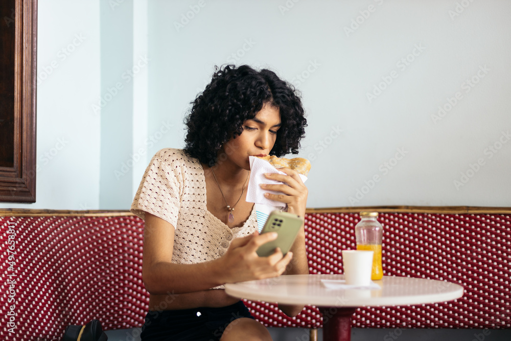 Young latin woman having breakfast Young latin woman having breakfast