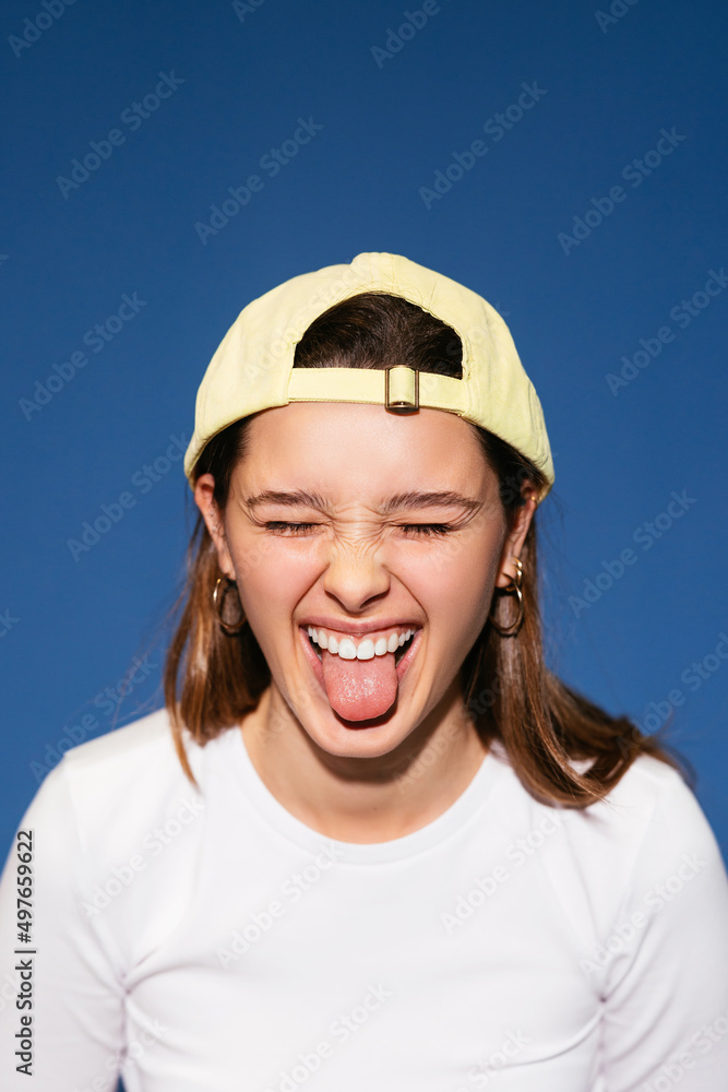 Naughty teen girl showing tongue in studio Naughty teen girl showing tongue in studio