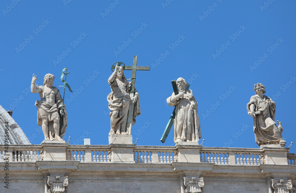 Very big Statue of Resurrected Jesus and more statues on the facade of the Basilica of Saint Peter in Vatican