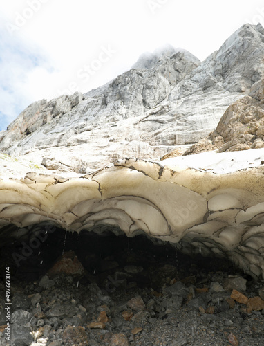 melting of the glacier on the alps due to global warming and climate changes photo