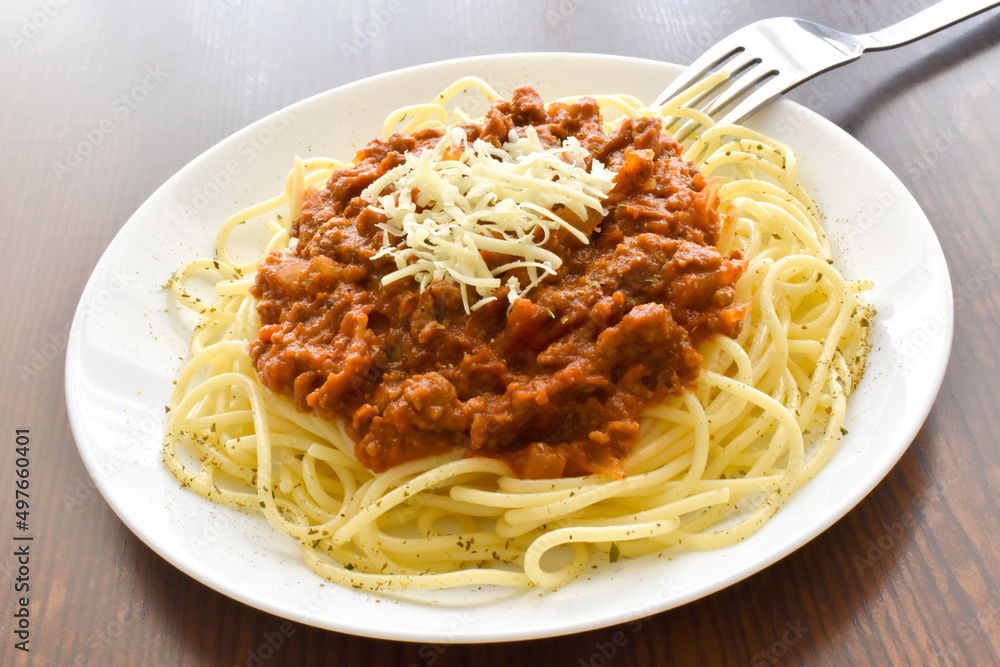 Spaghetti Bolognese with minced beef, onion, chopped tomato, garlic, olive oil, stock cube, tomato puree and Italian herb. Traditional Italian food on a plate.
Spaghetti Bolognese with minced beef, onion, chopped tomato, garlic, olive oil, stock cube, tomato puree and Italian herb. Traditional Italian food on a plate.