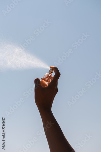 Spraying perfume photo