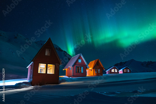 Northern Lights in Alaska's Mountains Over Red Cabins photo