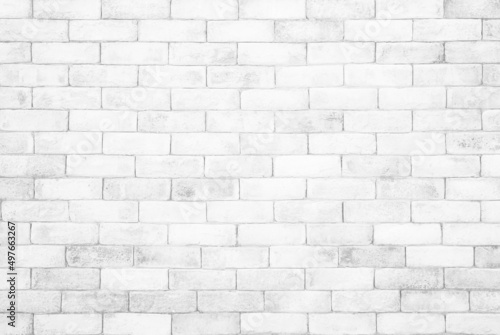 White grunge brick wall texture background for stone tile block painted in grey light color wallpaper design element.