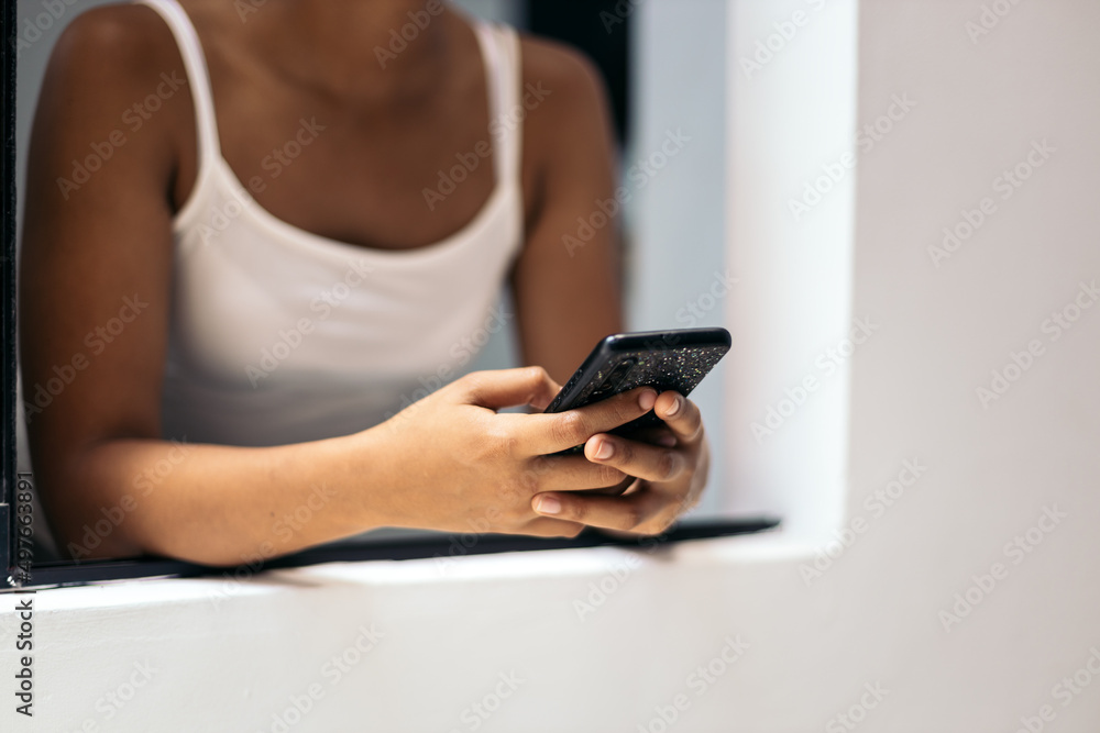 Young woman using the mobile at home Young woman using the mobile at home