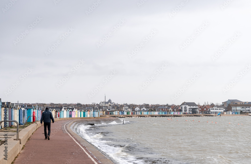 Promenade walker and beach huts