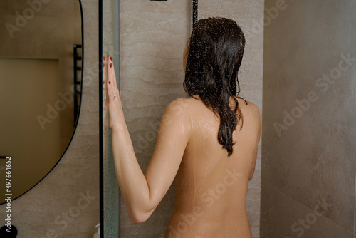  naked woman while taking shower at home photo