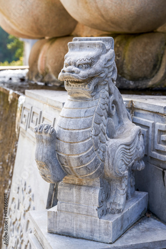 A stone statue of a traditional Chinese mythical beast unicorn