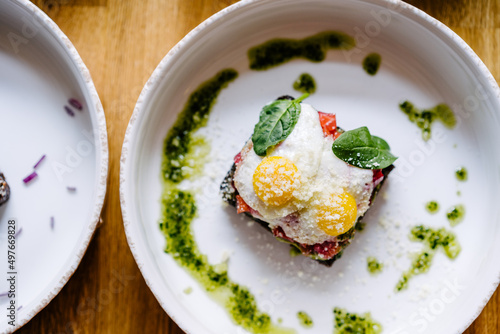 Fotografia Smorrebrod, Danish open sandwich with salmon, egg, avocado and cilantro sauce