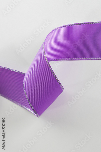 Spiral purple ribbon close up. Structural purple ribbon. Decorative ribbon.
