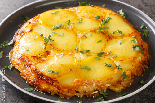 English potato casserole Pan haggerty close-up in a plate on the table. horizontal photo