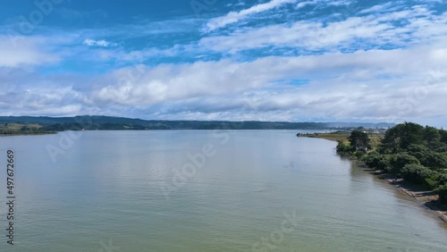 Fly over still waters of Ohiwa Harbour towards Ohope township - New Zealand photo