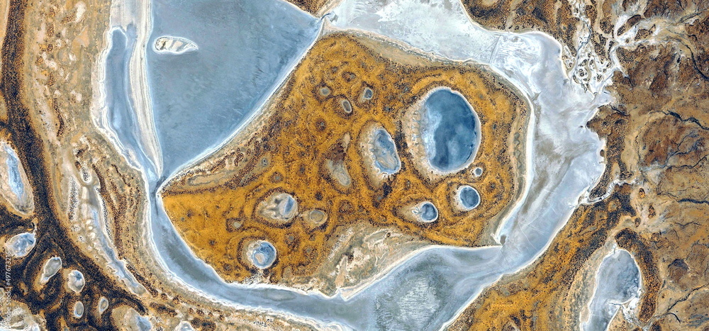 Fototapeta premium abstract landscape of the deserts of Africa from the air emulating the shapes and colors of the birth of life, Genre: Abstract Naturalism, from the abstract to the figurative