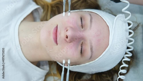 Cosmetic procedure to improve the condition of the skin of the face with microcurrents. Cosmetology and professional facial skin care.