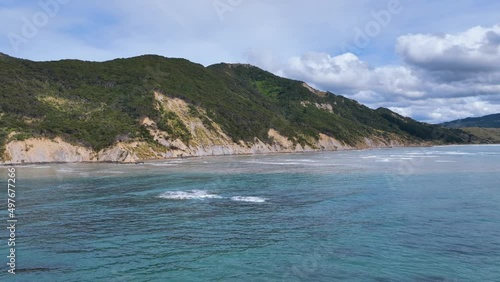 Wallpaper Mural Low flight over coastal waters, cliffs, and native bush of Anaura Bay - NZ Torontodigital.ca