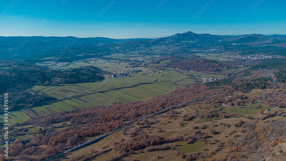 Beautiful drone panorama of Silentabor, a picturesque village on the top of a hill at slovenian karst region around Pivka on a sunny day.