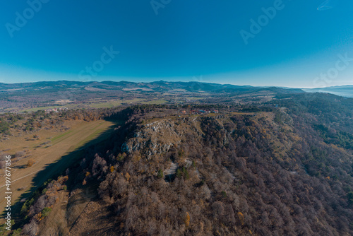 Beautiful drone panorama of Silentabor, a picturesque village on the top of a hill at slovenian karst region around Pivka on a sunny day.