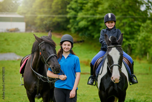 If you climb into the saddle be ready for the ride. Shot of young girls and their horses outdoors.