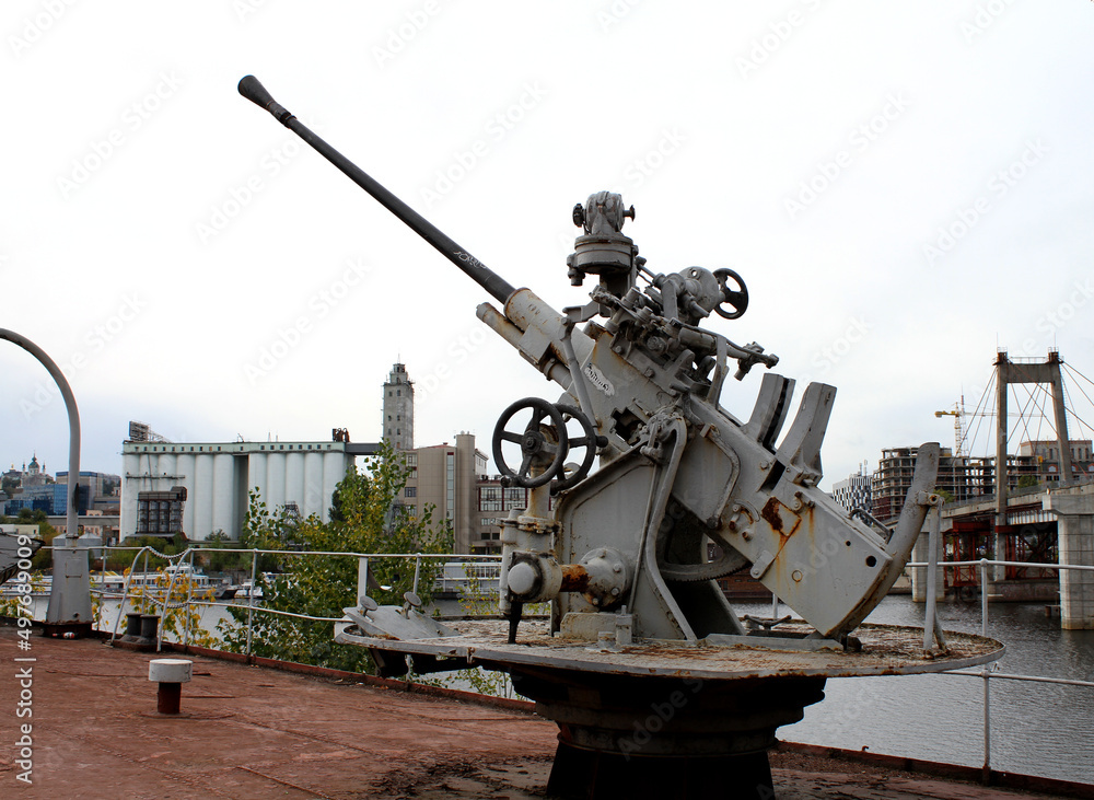Anti Aircraft Cannon On A Military Ship Over Modern City Anti Aircraft Cannon On A Military Ship Over Modern City