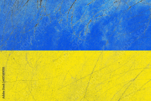 Distressed ukraine flag on a rustic concrete wall surface
