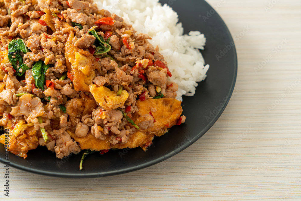 stir-fried minced pork with basil and egg topped on rice stir-fried minced pork with basil and egg topped on rice